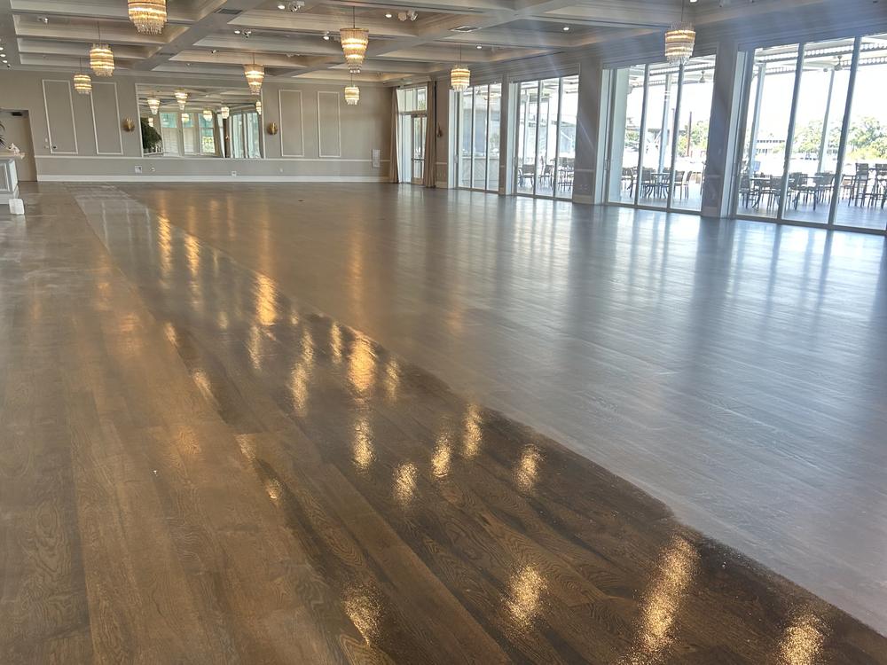 Refinished dark oak ballroom floor in a Wellington clubhouse